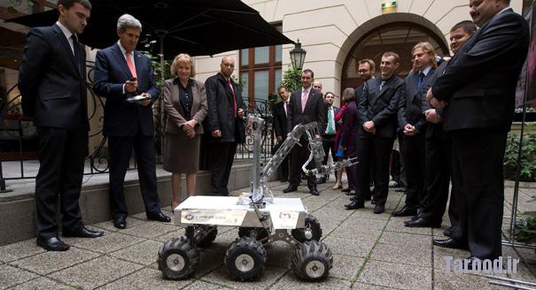 Kerry (second from left) controls a Mars rover prototype named