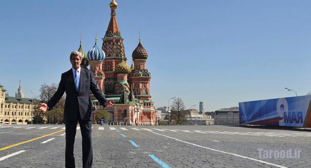 Kerry poses in front of St. Basil's cathedral during a walk at the Red Square in Moscow on May 7. | Reuters