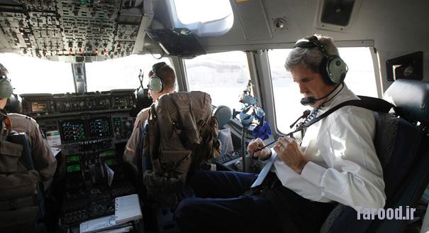 Kerry straps himself into the cockpit of an Air Force C-17 aircraft as he prepares to leave Baghdad following a short trip to the Iraqi capital on March 24. | Reuters