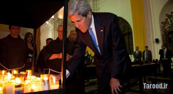 Kerry lights a candle during his visit to San Francisco Church in Antigua, Guatemala, on June 4. | AP Photo